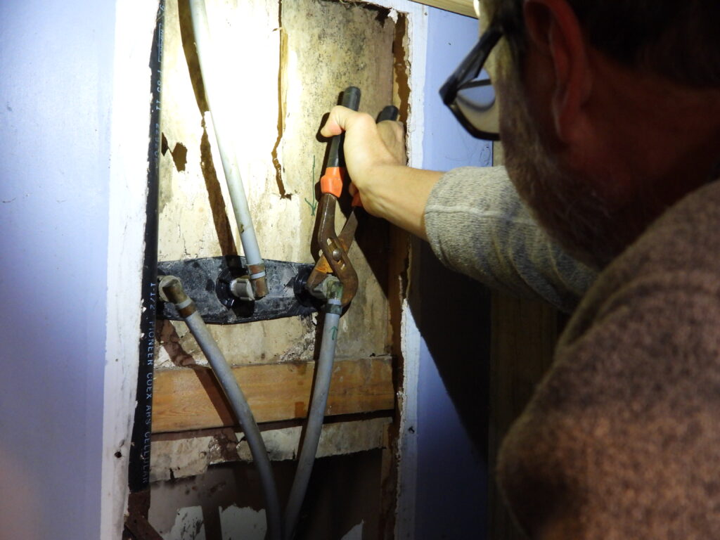 Shoring up the wall behind a bathtub faucet