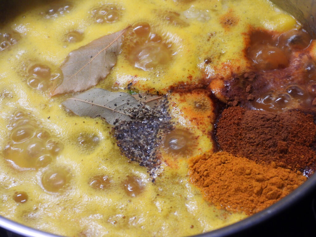 Adding spices to a soup